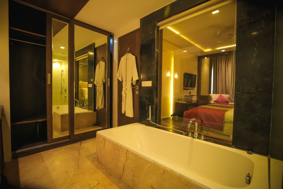 Standard Studio Suite | Bathroom | Bathtub, designer toiletries, slippers, towels