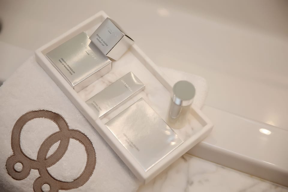 Designer toiletries, hair dryer, bathrobes, slippers