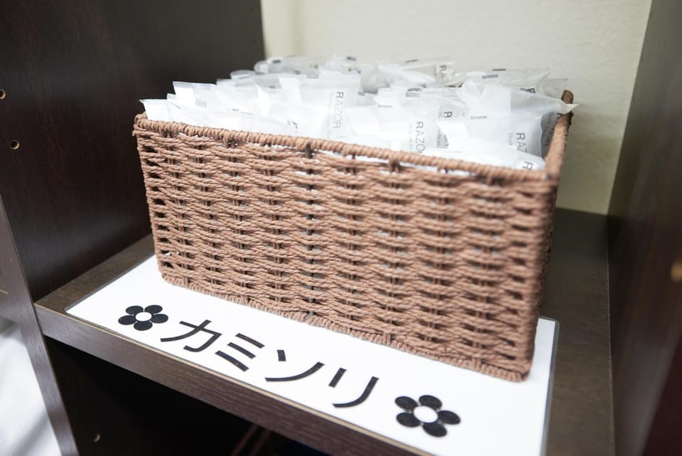 Combined shower/tub, free toiletries, hair dryer, slippers