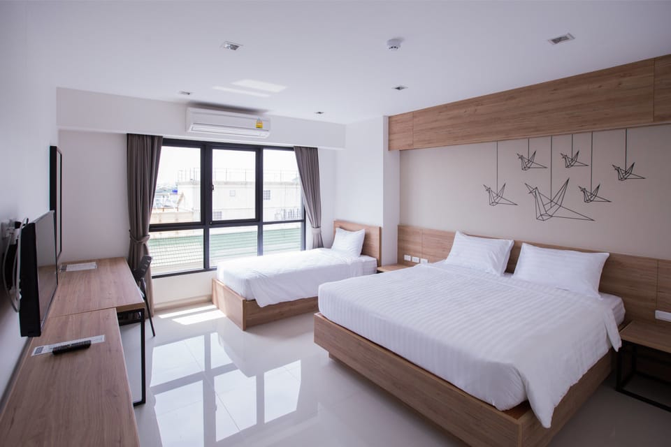 Triple Room | Desk, blackout drapes, free WiFi, bed sheets