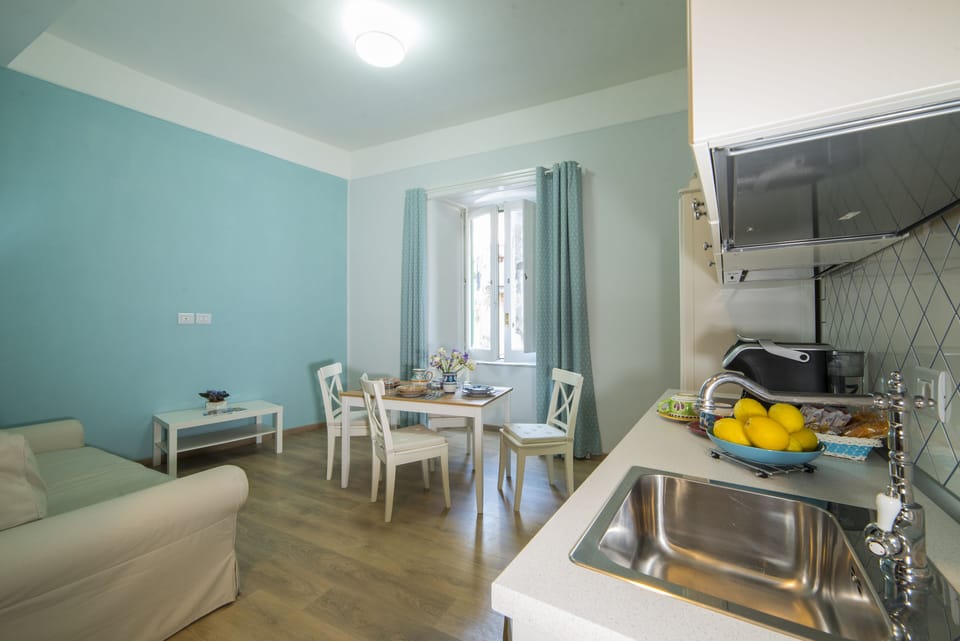 Family Condo, 1 Bedroom, City View | Living area | 40-inch flat-screen TV with digital channels, TV