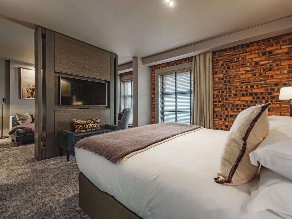 Deluxe Suite | Premium bedding, desk, laptop workspace, iron/ironing board