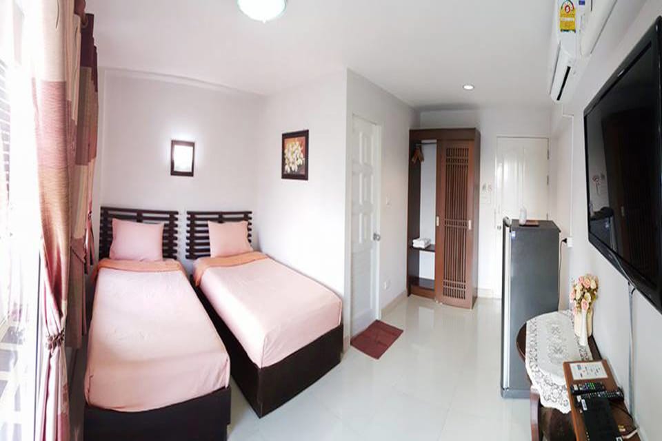 Twin Bed | Blackout drapes, free WiFi, bed sheets