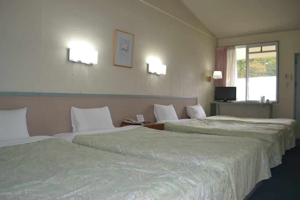 Basic Quadruple Room, 4 Bedrooms, Non Smoking | Free WiFi, bed sheets