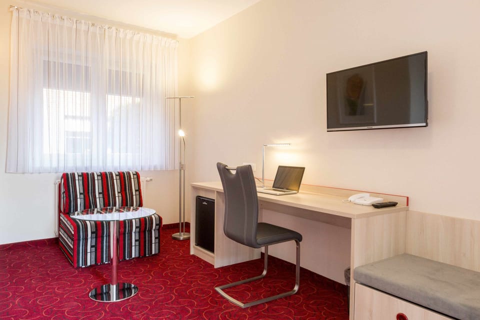 Premium bedding, desk, laptop workspace, iron/ironing board