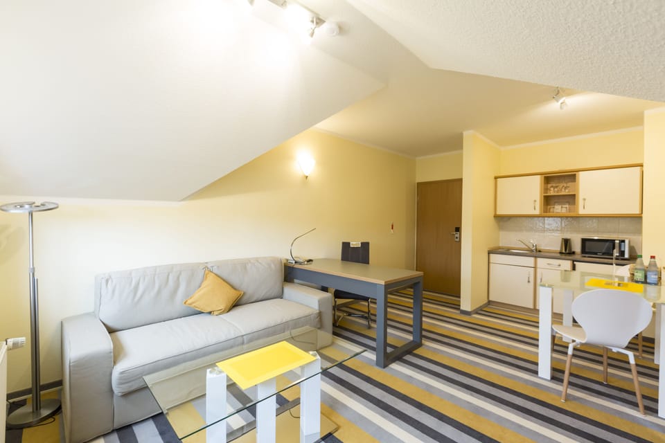 Premium bedding, desk, laptop workspace, iron/ironing board
