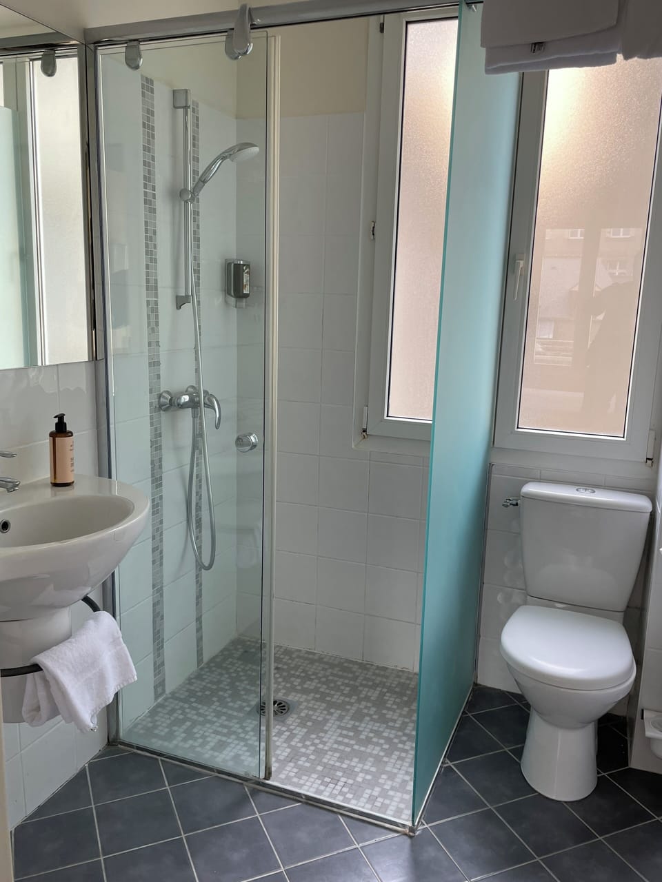 Twin Room | Bathroom | Shower, hair dryer, towels