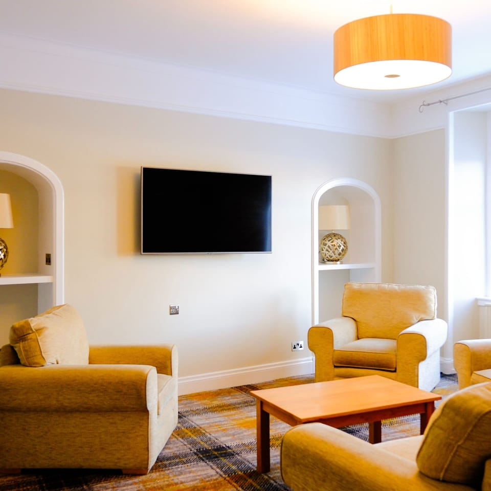 Exclusive Suite, 1 King Bed with Sofa bed, River View, Ground Floor | Living area | 35-inch flat-screen TV with digital channels