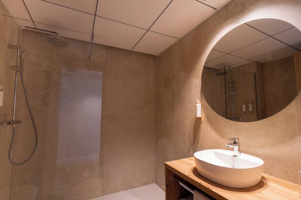 Shower, eco-friendly toiletries, hair dryer, towels