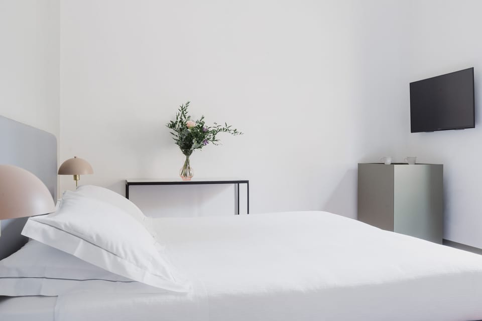 Superior Room | Minibar, in-room safe, desk, iron/ironing board