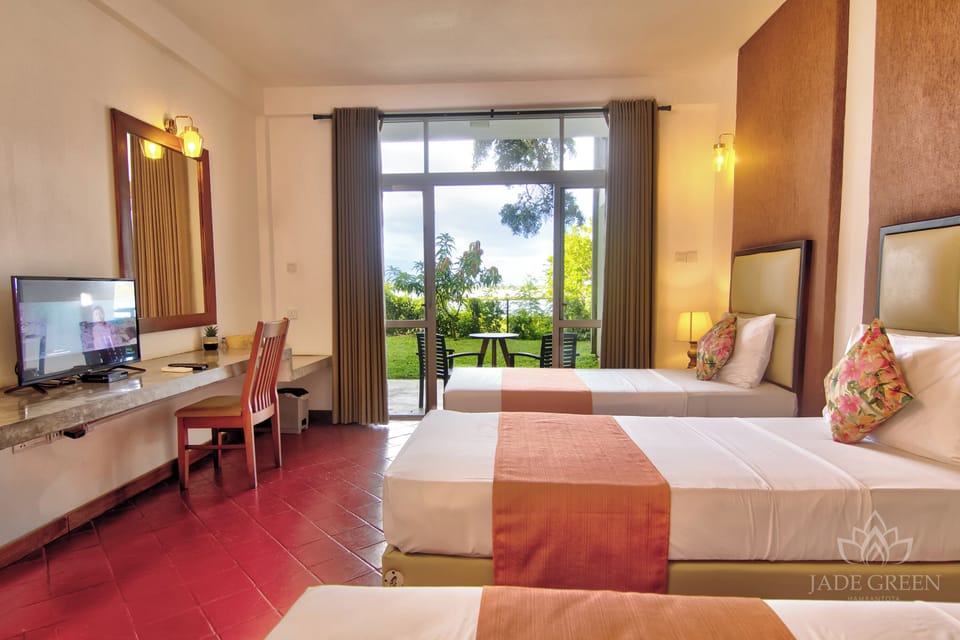 Deluxe Triple Room, Lake View | In-room safe, desk, blackout drapes, soundproofing