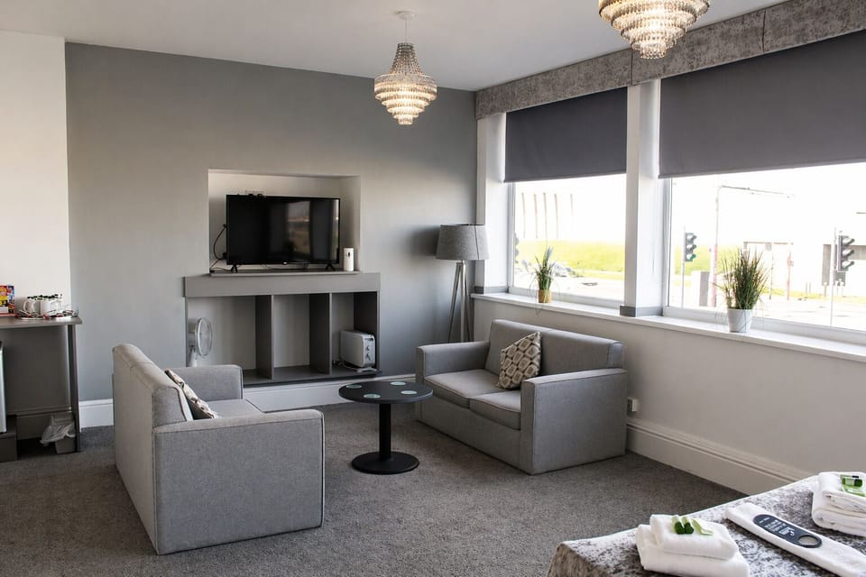 Superior Suite, Sea View | Living area | Flat-screen TV