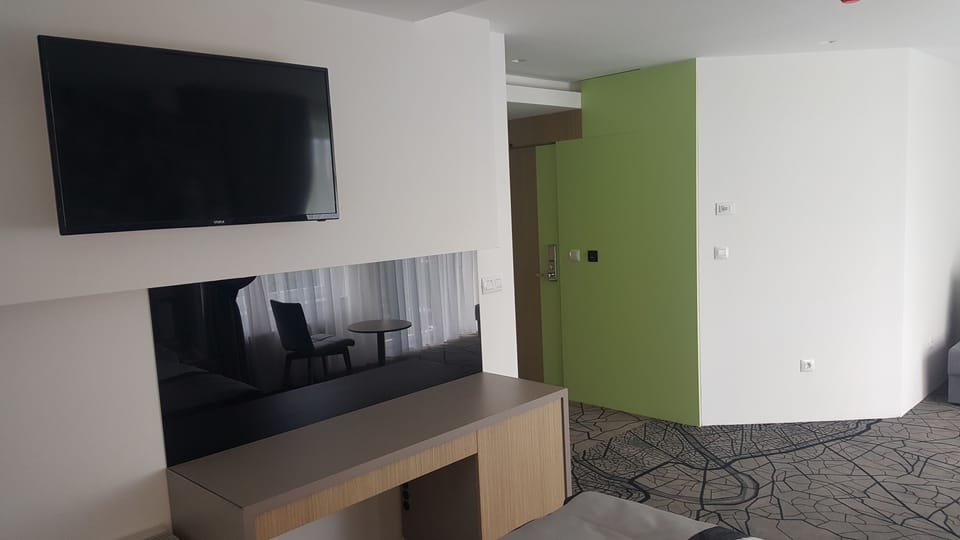 Standard Quadruple Room, 1 Bedroom, Accessible | Minibar, in-room safe, desk, laptop workspace