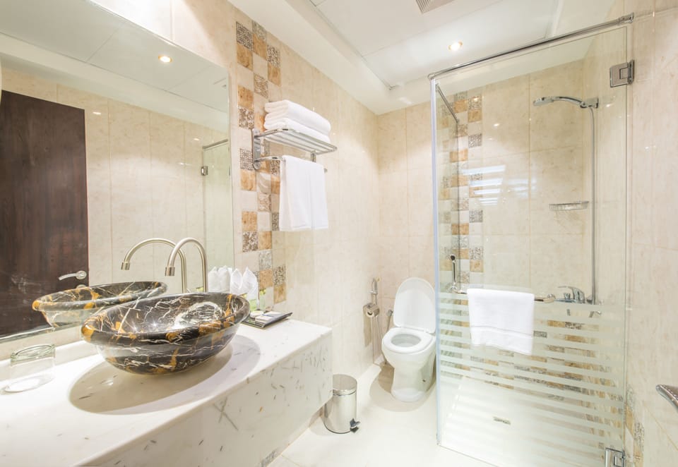 Shower, free toiletries, hair dryer, slippers
