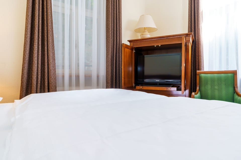 Standard Double or Twin Room | In-room safe, desk, laptop workspace, blackout drapes