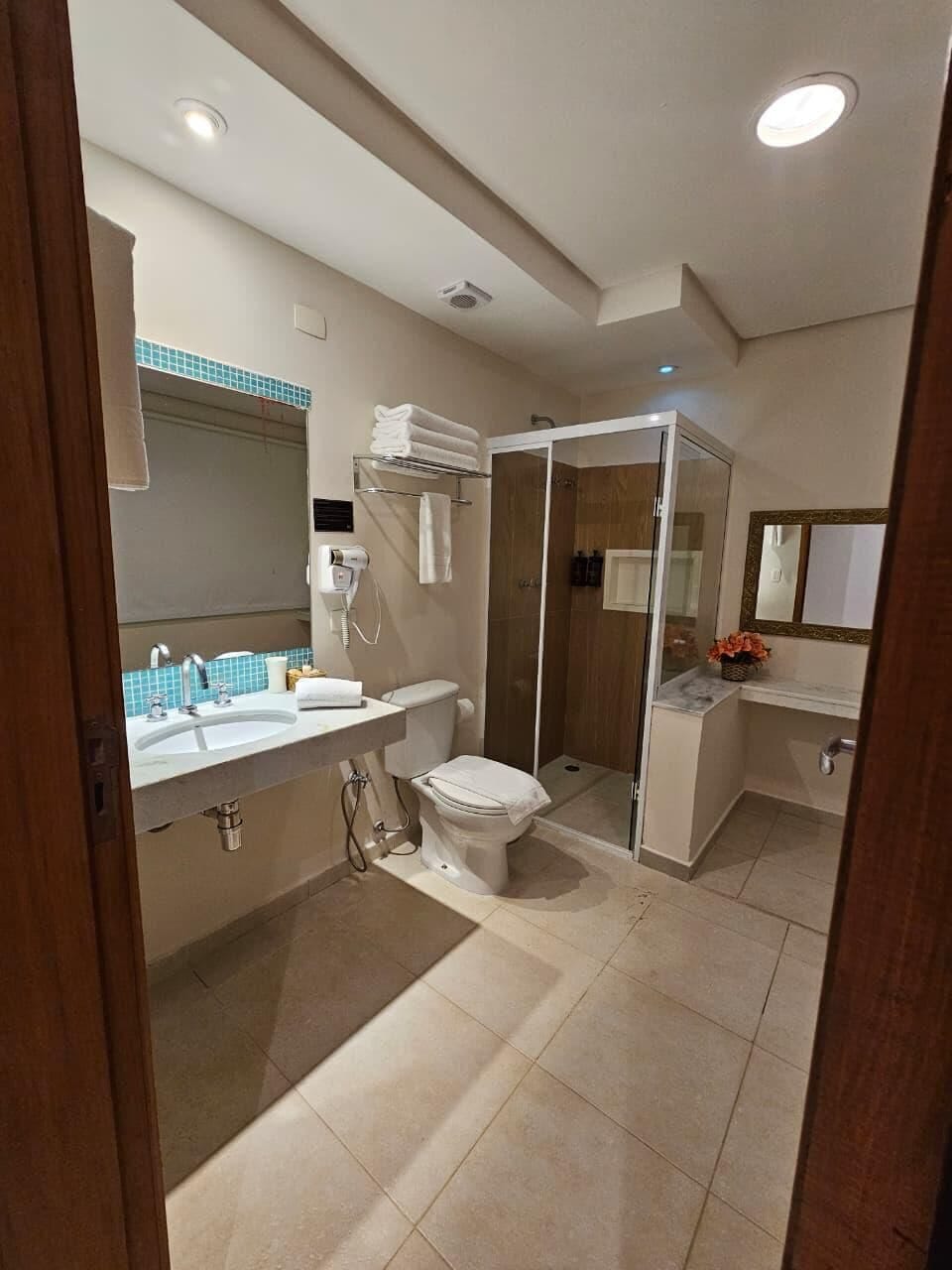 Luxury Room, Patio, Sea View | Bathroom | Shower, hair dryer, towels