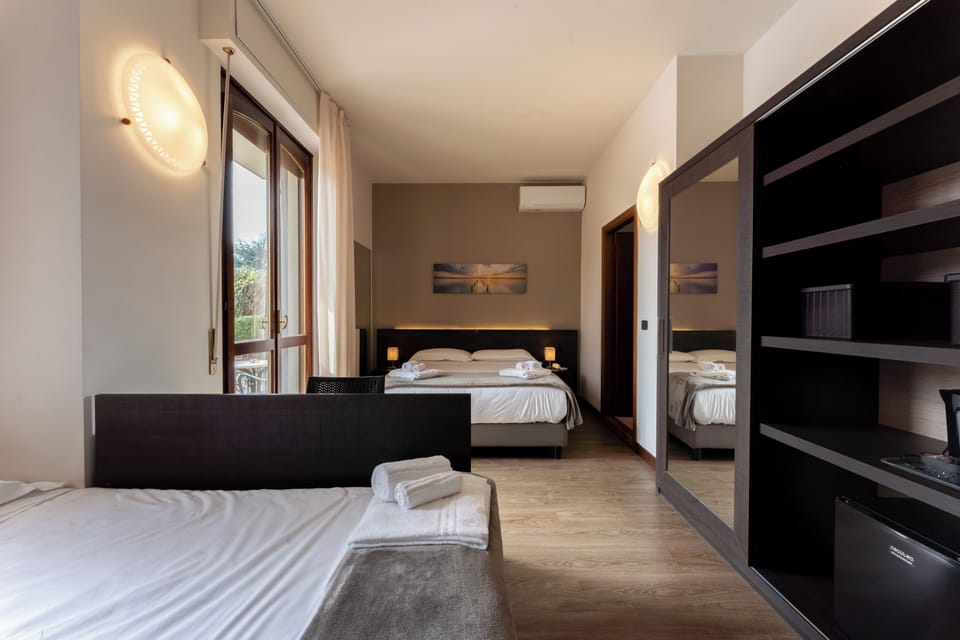 Classic Quadruple Room | Down comforters, in-room safe, individually decorated