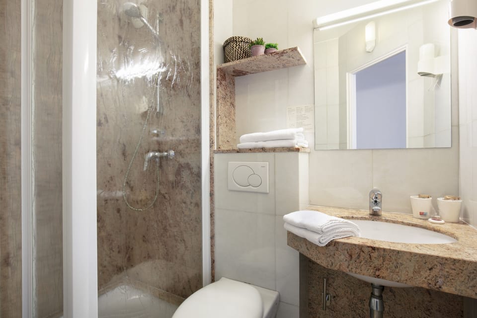 Shower, free toiletries, hair dryer, towels