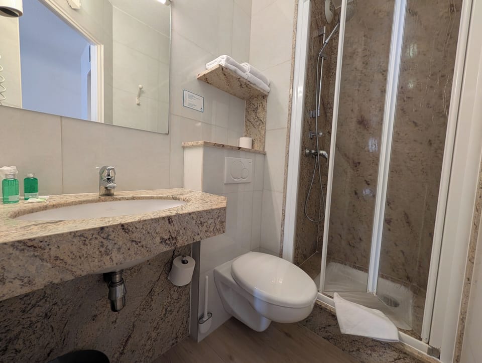 Shower, free toiletries, hair dryer, towels
