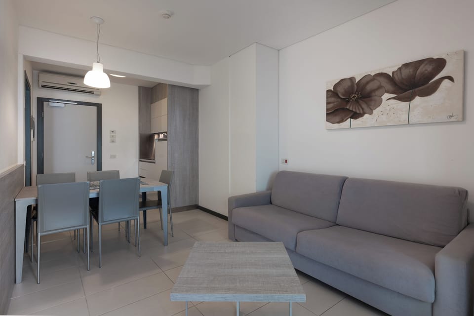 Apartment, Balcony | Living area | 50-cm flat-screen TV with satellite channels
