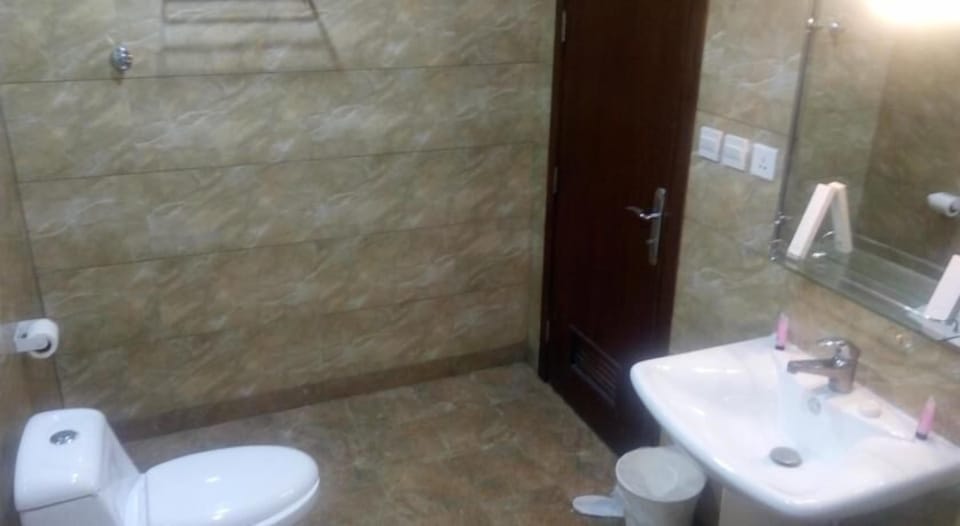 Shower, bathrobes, slippers, bidet