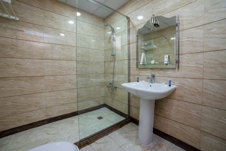 Shower, bathrobes, slippers, bidet