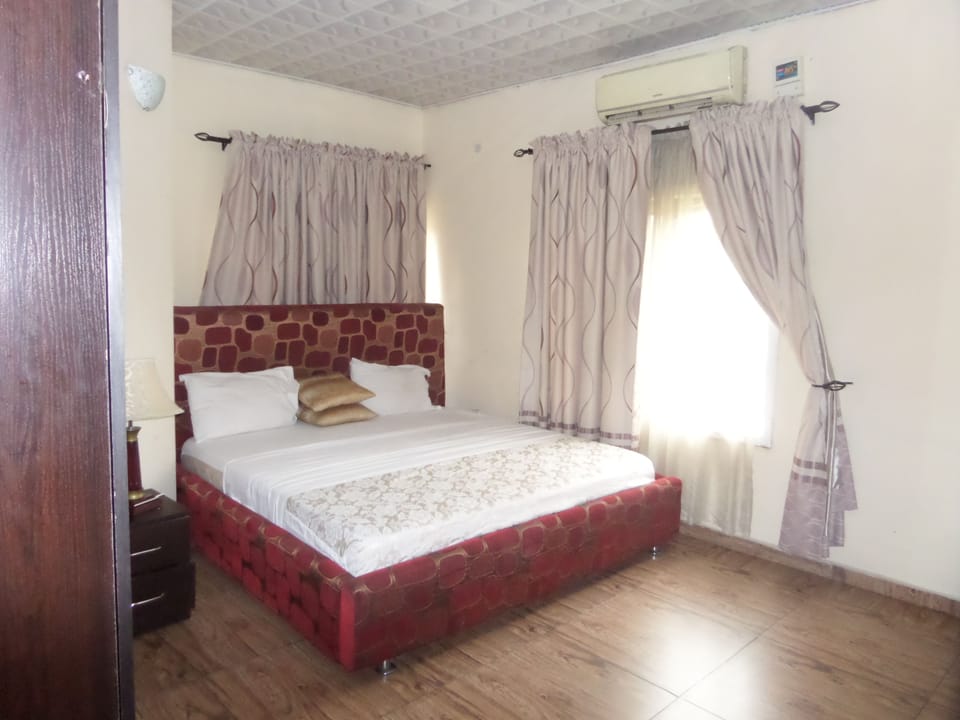 Desk, laptop workspace, bed sheets