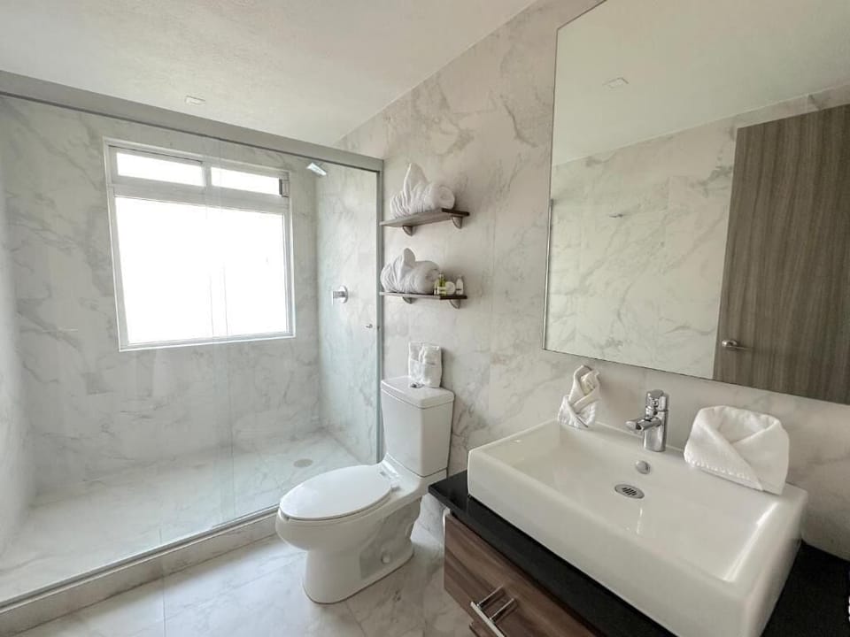 Luxury Suite, 2 Bedrooms | Bathroom | Shower, free toiletries, hair dryer, towels