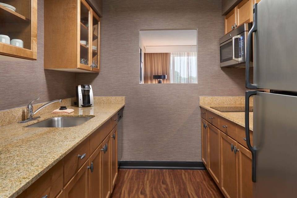 Suite, 1 Bedroom | Private kitchen | Fridge, microwave, stovetop, coffee/tea maker