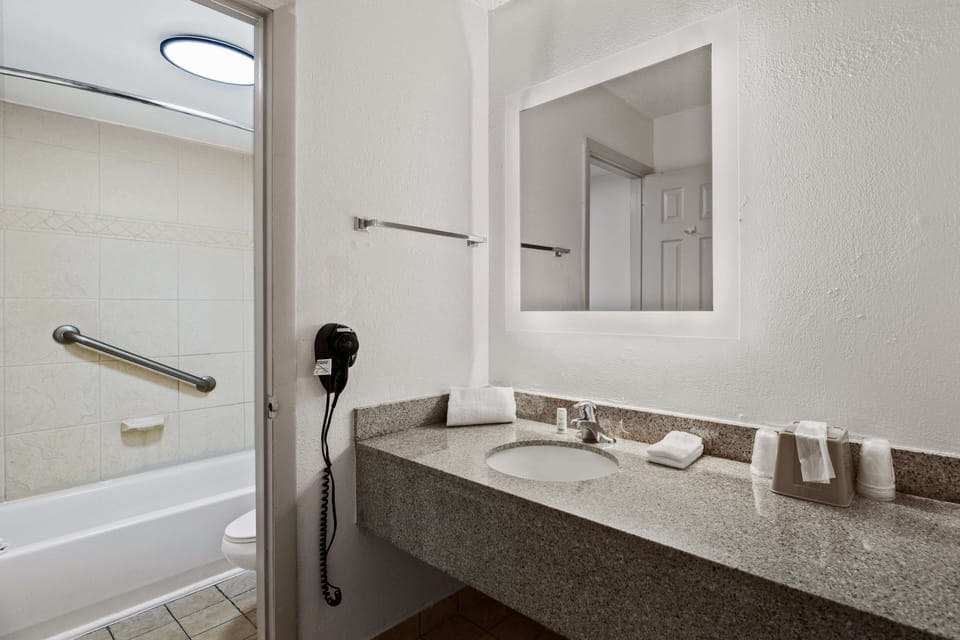 Room, 2 Double Beds, Non Smoking | Bathroom | Combined shower/tub, free toiletries, hair dryer, towels