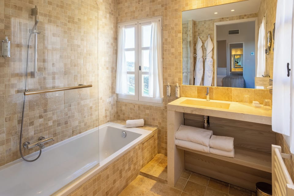 Deep soaking tub, free toiletries, hair dryer, bathrobes