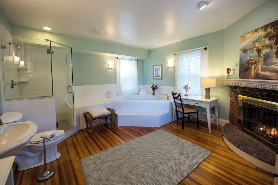 Chapman Cottage Premier King | Bathroom | Designer toiletries, hair dryer, towels, toilet paper