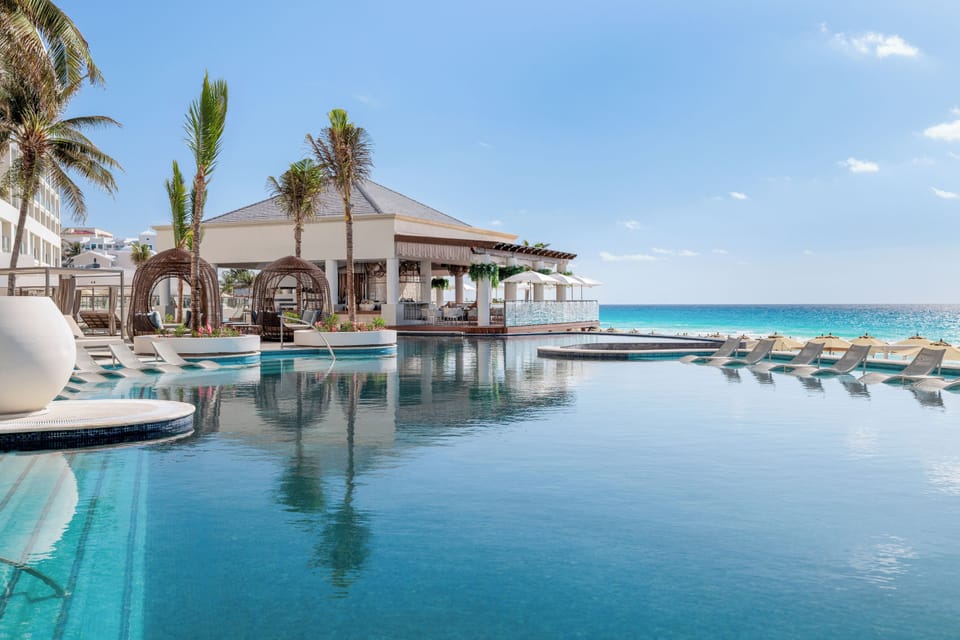 Outdoor pool, pool umbrellas, sun loungers