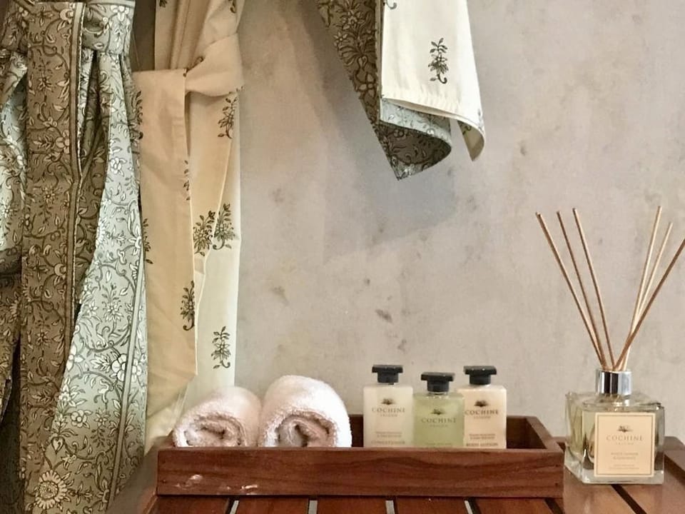 Designer toiletries, hair dryer, bathrobes, towels