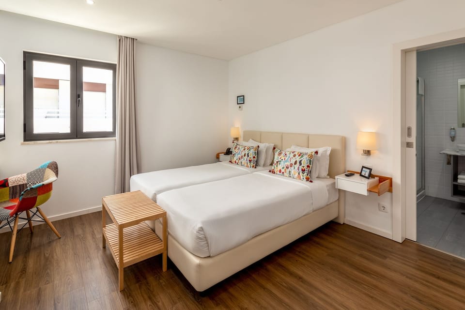 Standard Double or Twin Room | Minibar, in-room safe, desk, blackout drapes