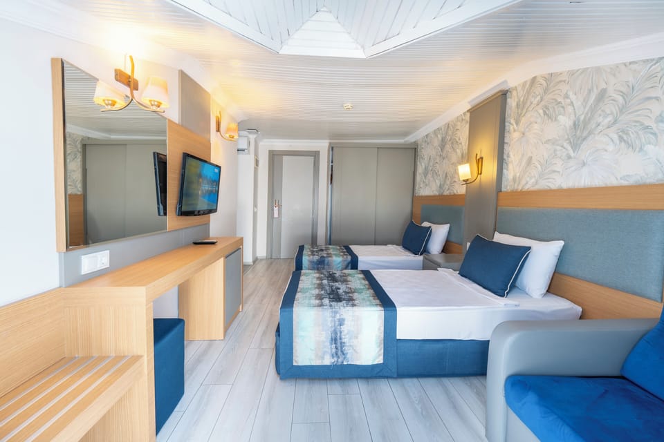 Annex Family Room | Free minibar items, in-room safe, desk, laptop workspace