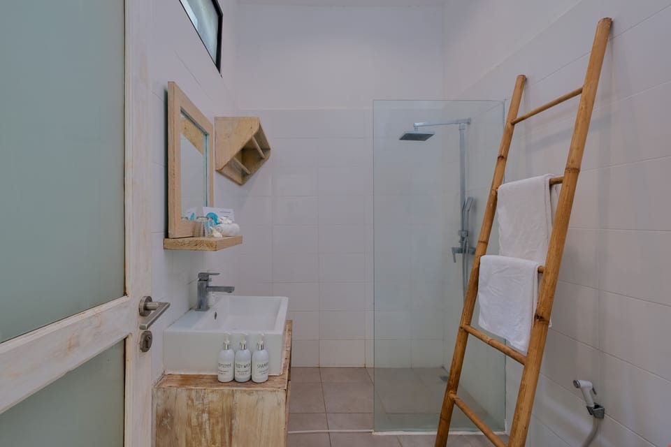 King Bedroom Garden View | Bathroom | Shower, free toiletries, towels, soap