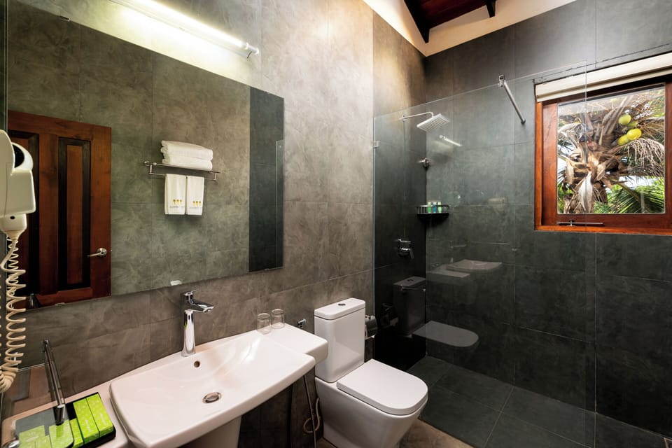 Luxury Suite, 2 Bedrooms, Garden View | Bathroom | Shower, free toiletries, hair dryer, towels