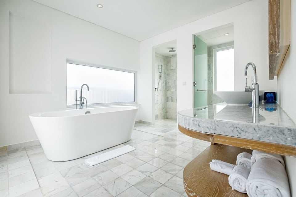 Duplex Residence Balcony Pool view | Bathroom | Shower, rainfall showerhead, hair dryer, bathrobes
