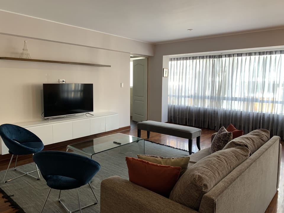 Comfort Apartment, 3 Bedrooms | Living area | Flat-screen TV