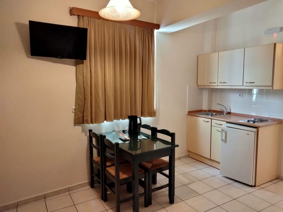 Mini-fridge, stovetop, dining tables