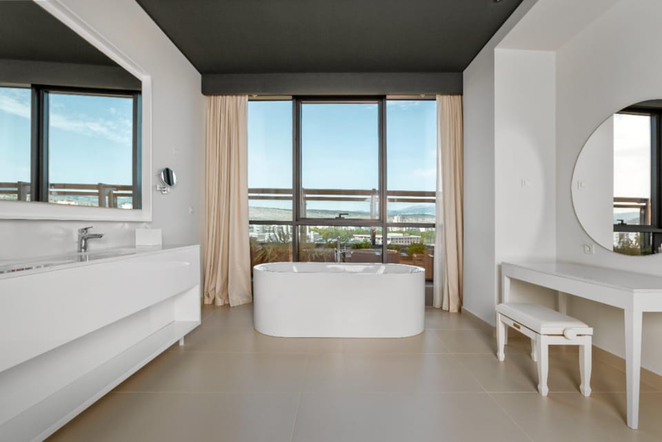 Designer toiletries, hair dryer, bathrobes, slippers