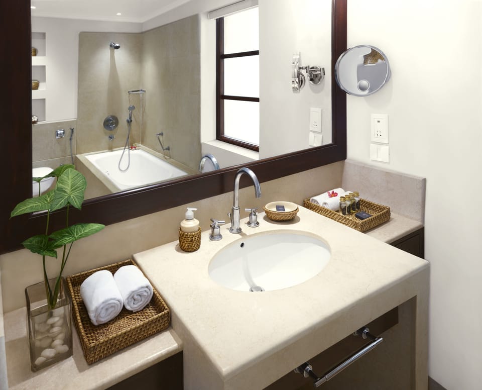 Separate tub and shower, designer toiletries, hair dryer, bathrobes