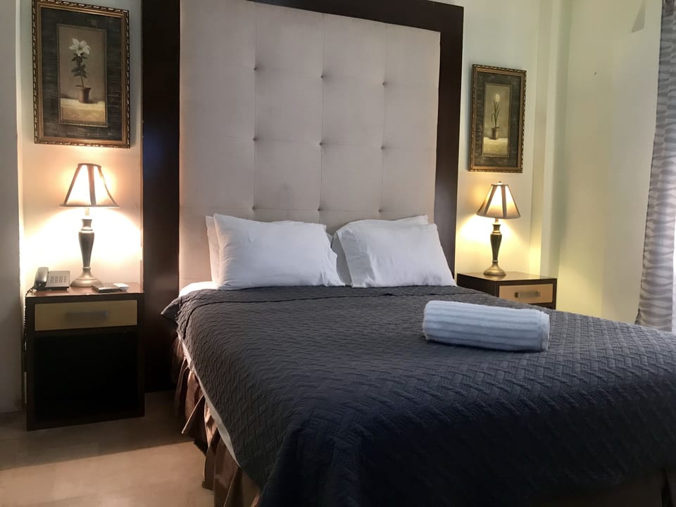 Exclusive Room, 1 Bedroom, City View | 1 bedroom, minibar, in-room safe, desk