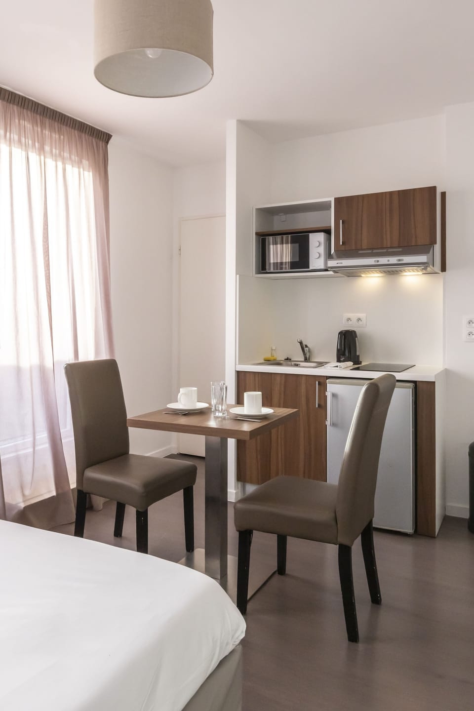 Standard Studio (2 People) | Desk, laptop workspace, soundproofing, free cribs/infant beds