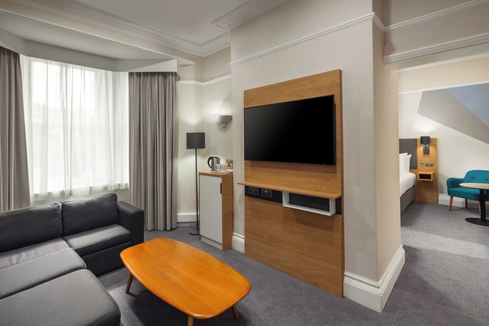 Desk, laptop workspace, blackout drapes, soundproofing