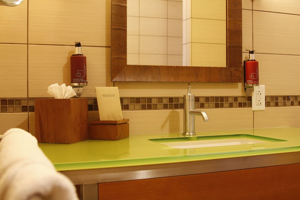 Combined shower/tub, designer toiletries, hair dryer, bathrobes