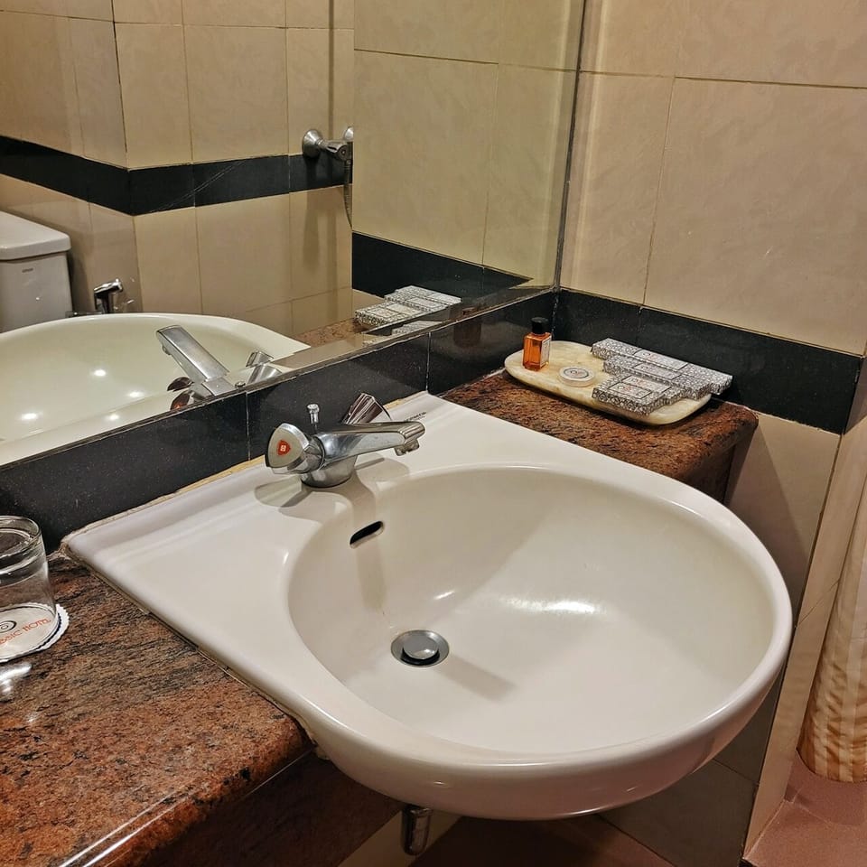 Shower, free toiletries, hair dryer, slippers
