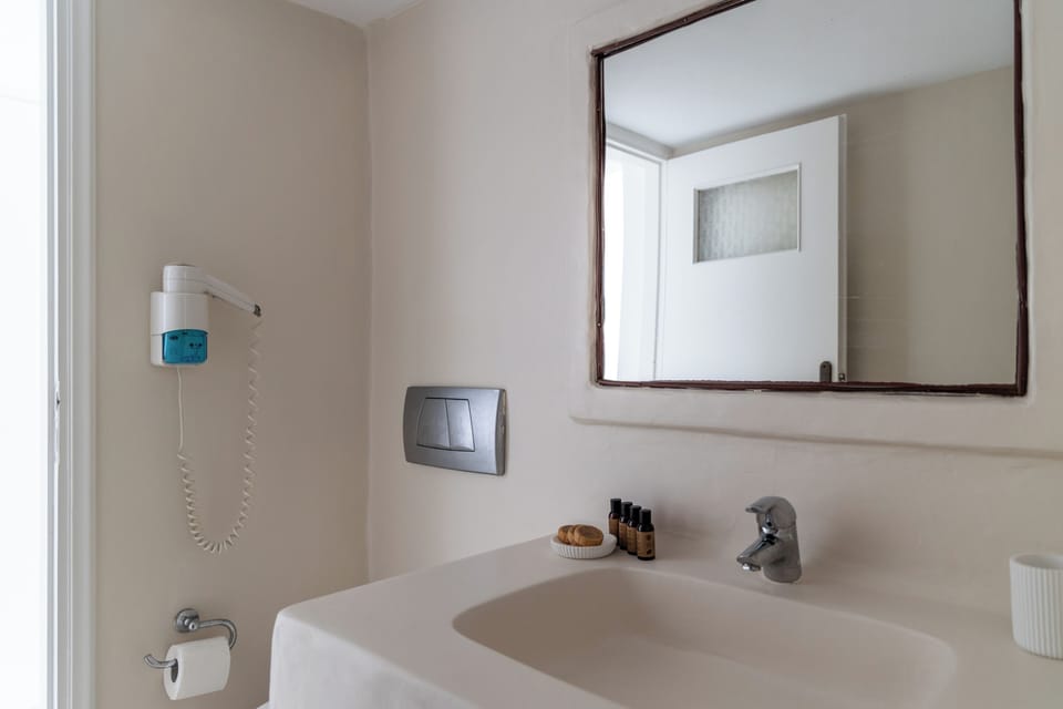 Shower, rainfall showerhead, hair dryer, towels