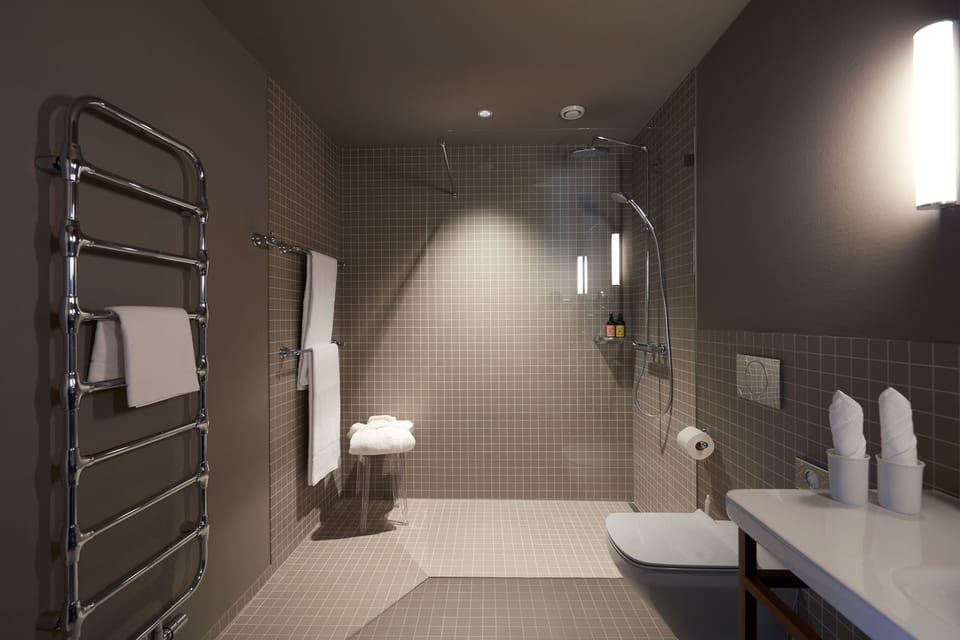Shower, rainfall showerhead, designer toiletries, hair dryer